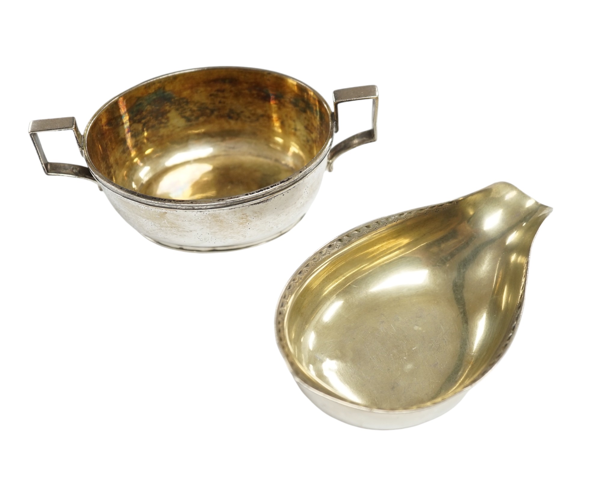 A George III silver two handled oval tub salt by John Eames, London, 1806, 12cm, together with a Georgian silver pap boat (marks rubbed). Condition - poor to fair